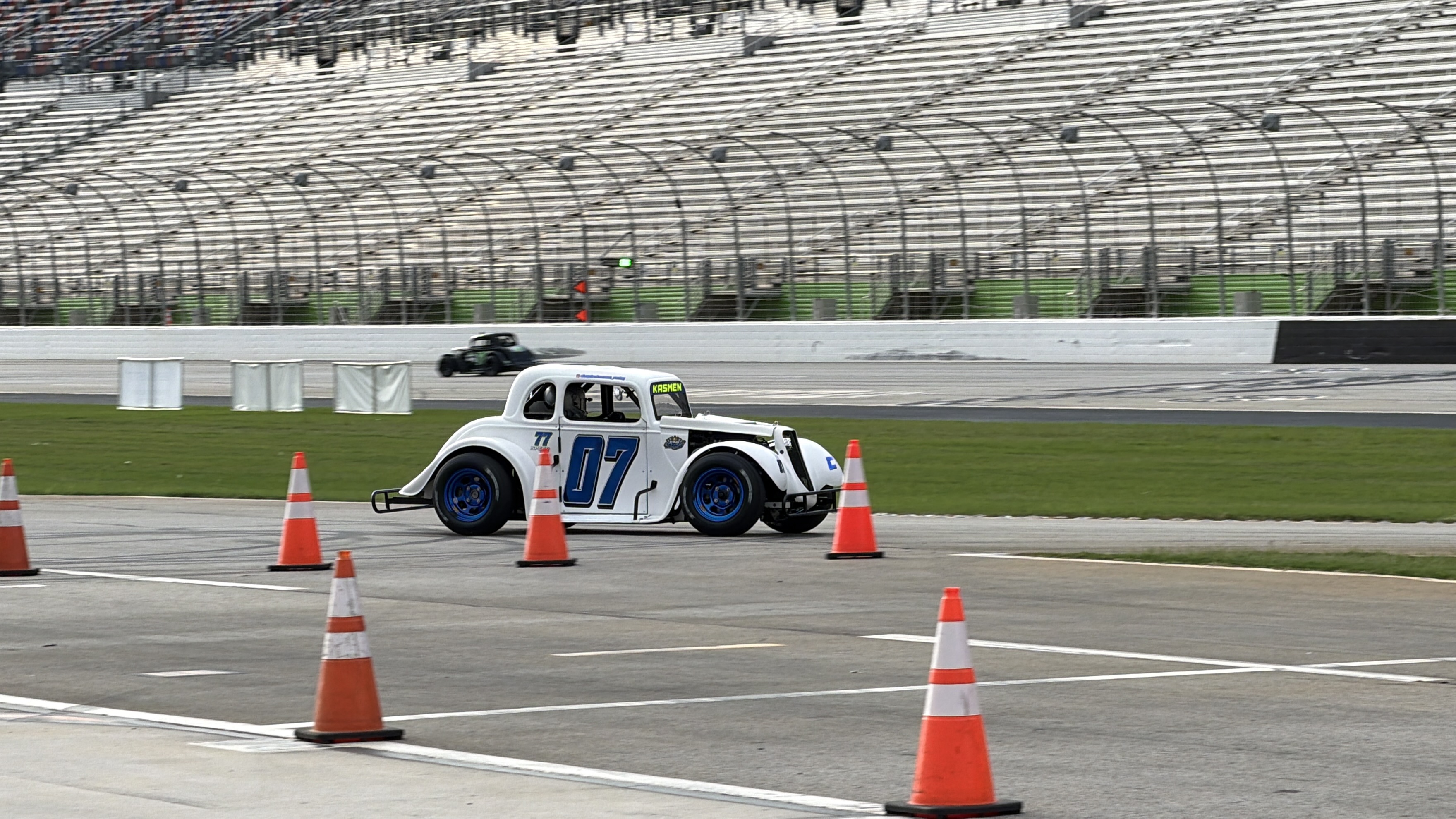 Hayden's car on track weaving through cones during a practice session